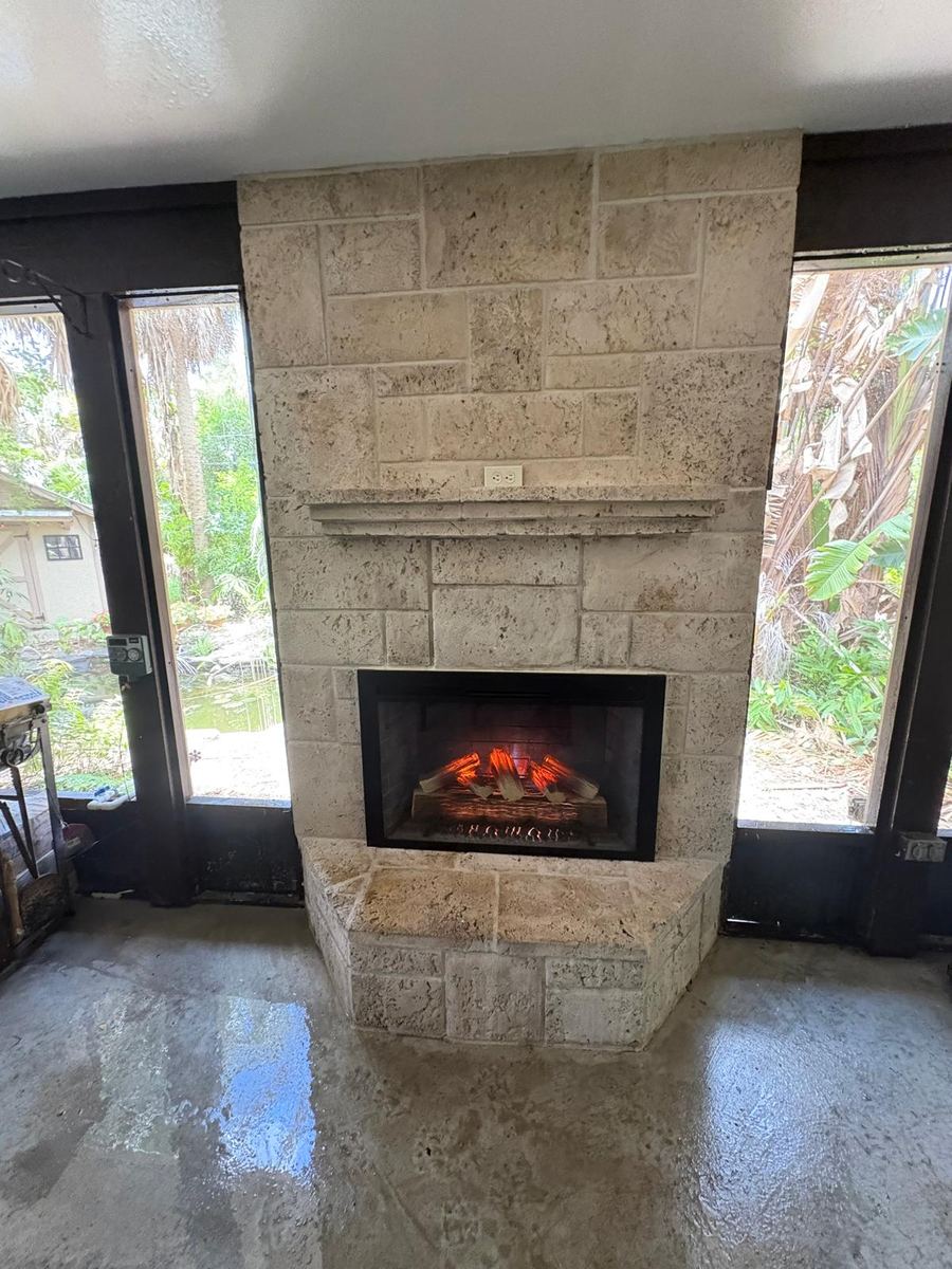 Restored stone fireplace with new insert